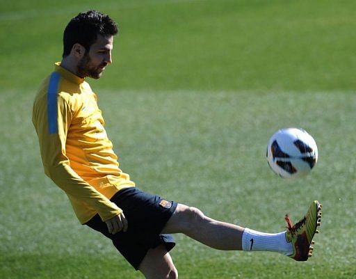 Barcelona's midfielder Cesc Fabregas controls the ball during a training session near Barcelonaon on February 13, 2013